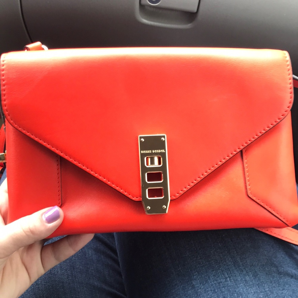 NWOT henri Bendel purse in a coral/orange color